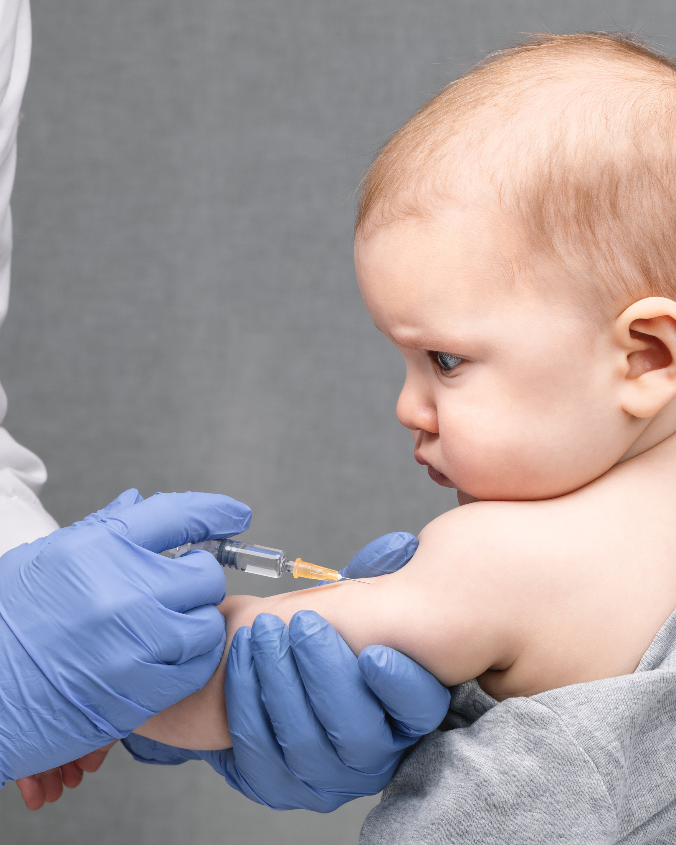 Pharmacist giving Tdap vaccine