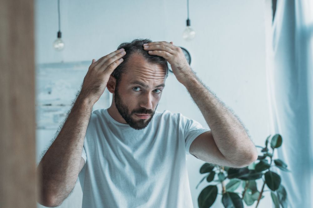 Understanding alopecia and hair loss – Rock Ridge Pharmacy Woman embracing her natural beauty with alopecia