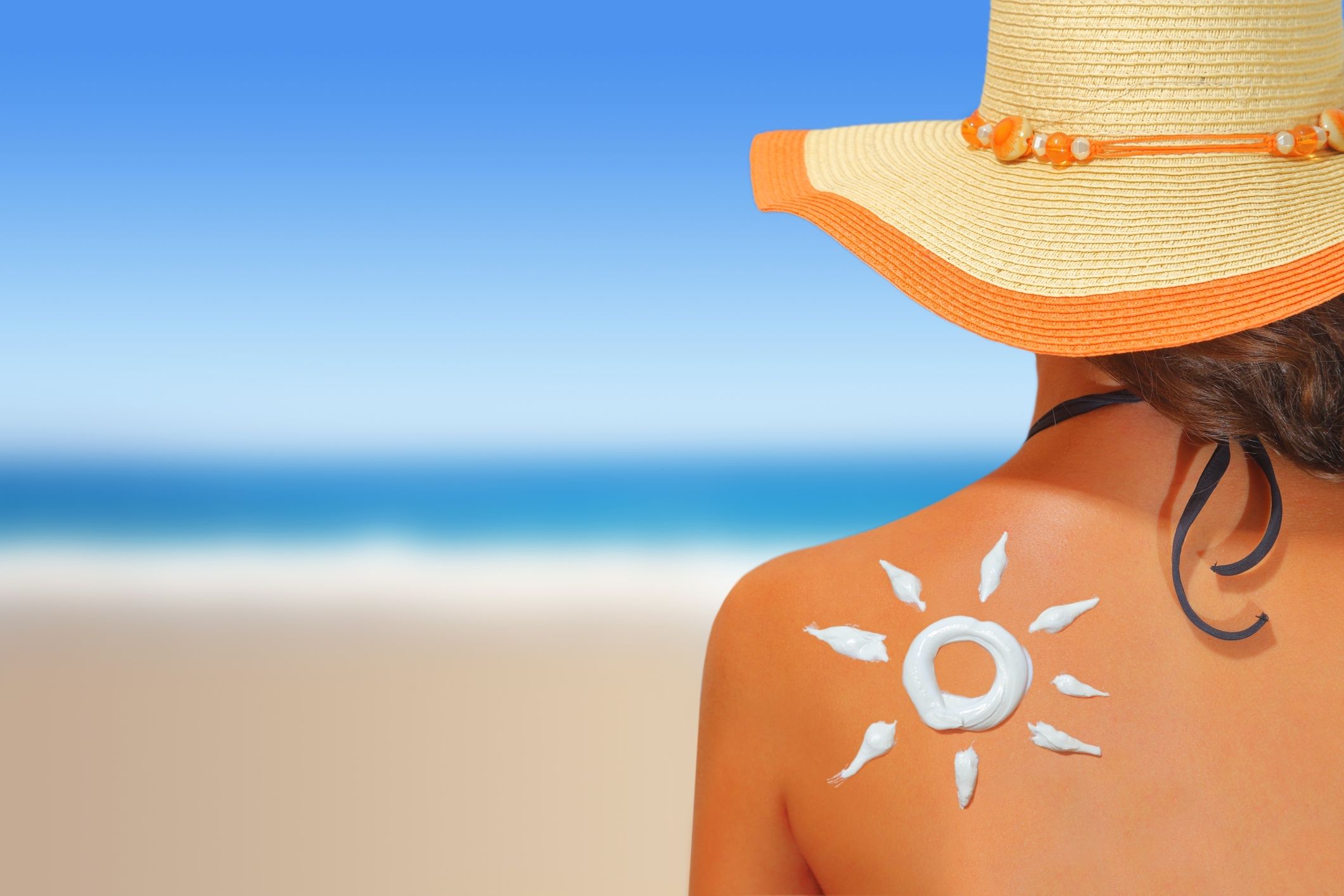 Sunscreen and daily skin protection – Rock Ridge Pharmacy Dermatologist applying sunscreen for daily skin protection