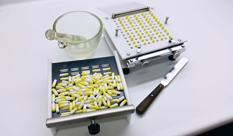 Pharmacist preparing custom compounded medication