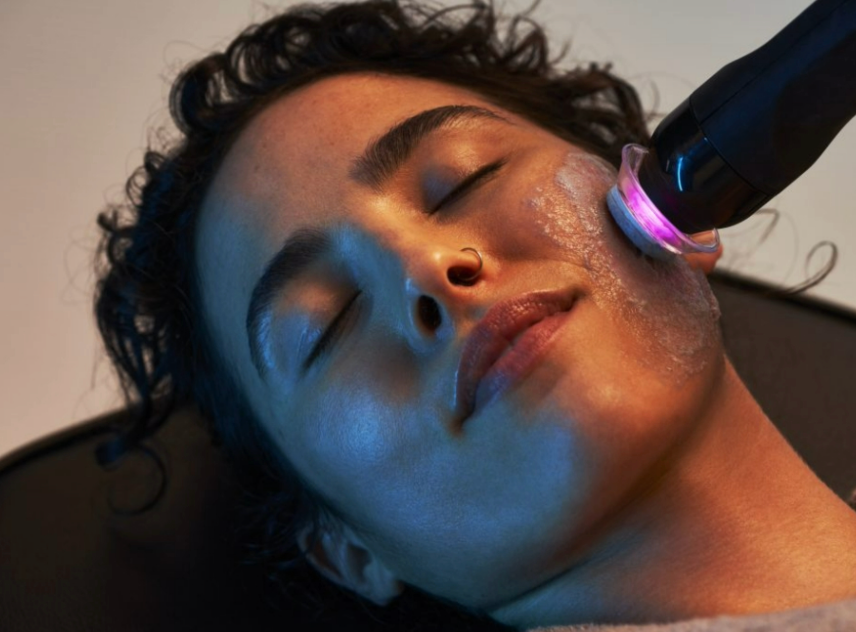 Close up image up woman's face mid-HydraFacial HydraFacial Image