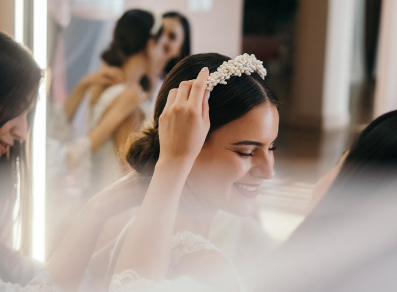 Bridal hair look with headband being placed Bridal hair with headband being placed
