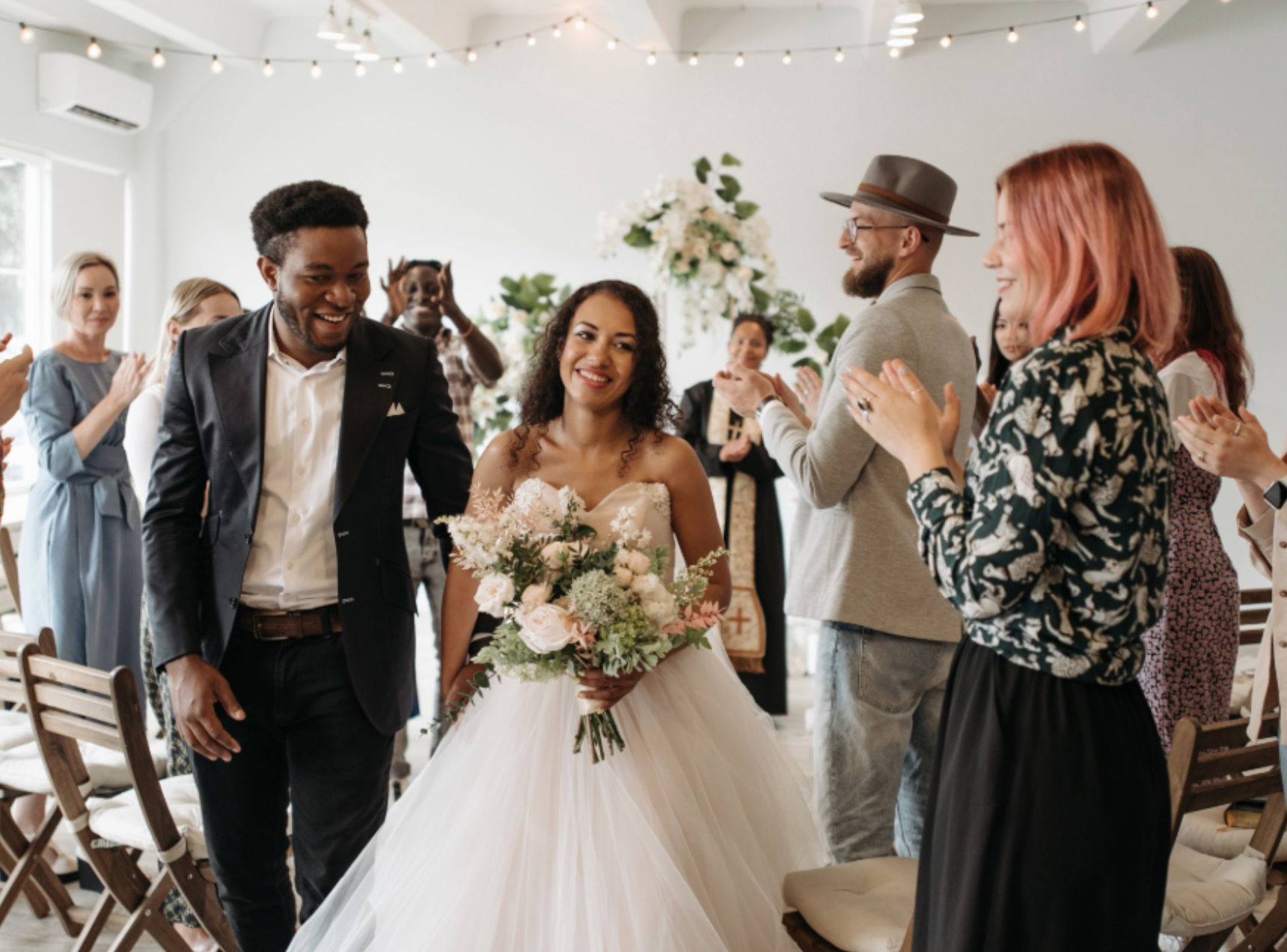 Bride and groom smiling walking down aisle after ceremony Image of bride post-ceremony