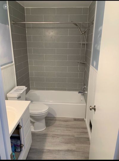 Blue Bathroom with Dark Gray Subway Tile Shower