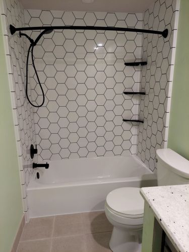 Green Bathroom with White Hexagon Tile Shower