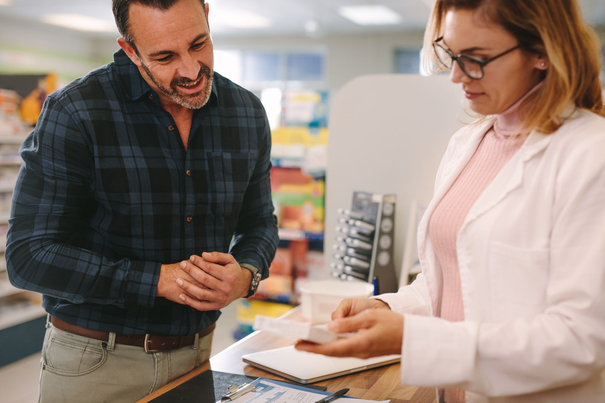 Pharmacist with patient